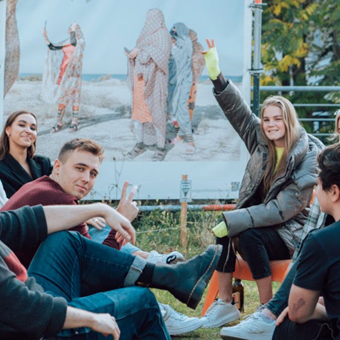 Students enjoying together on terrace